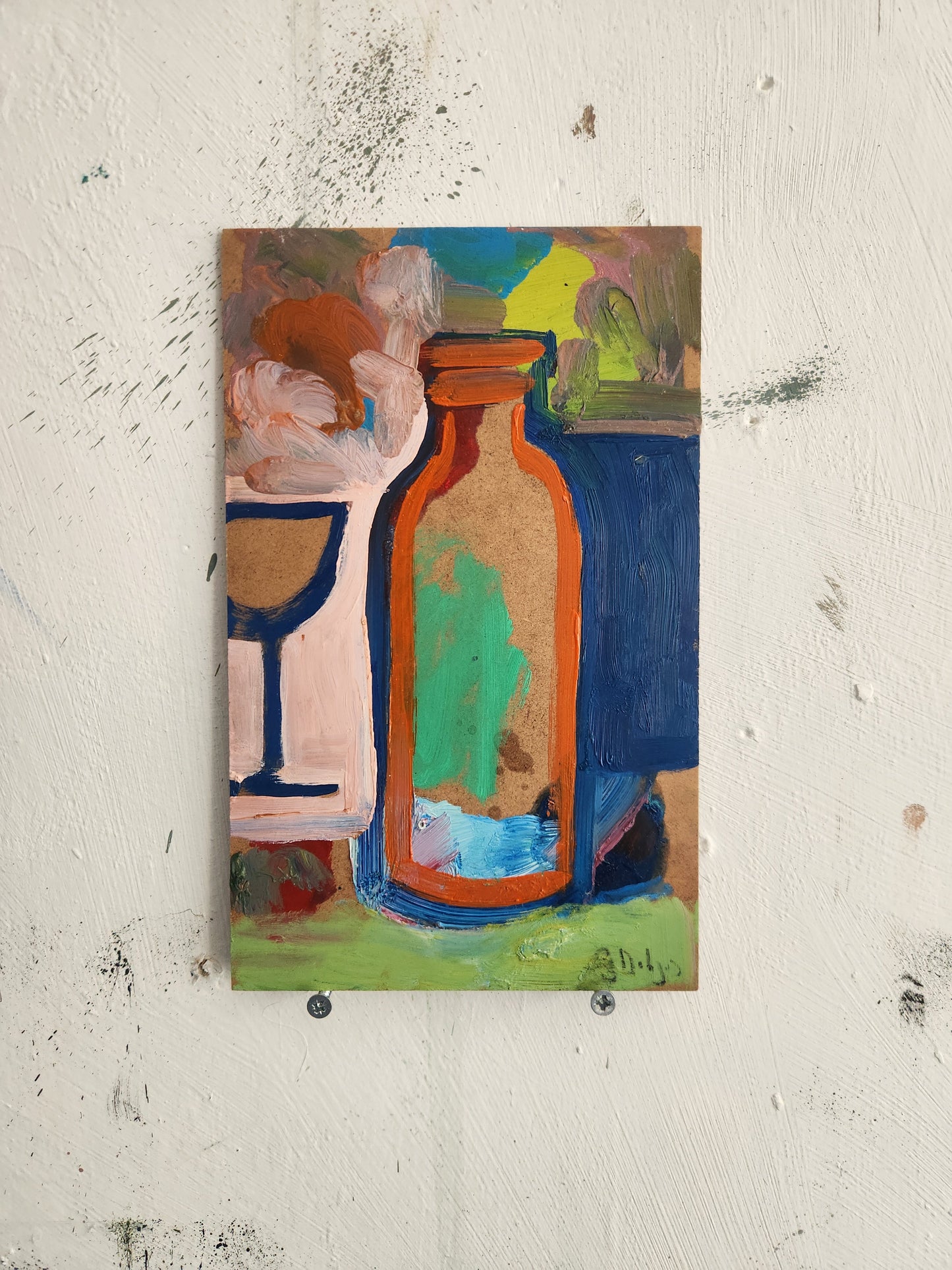 Bottle in front of a glass