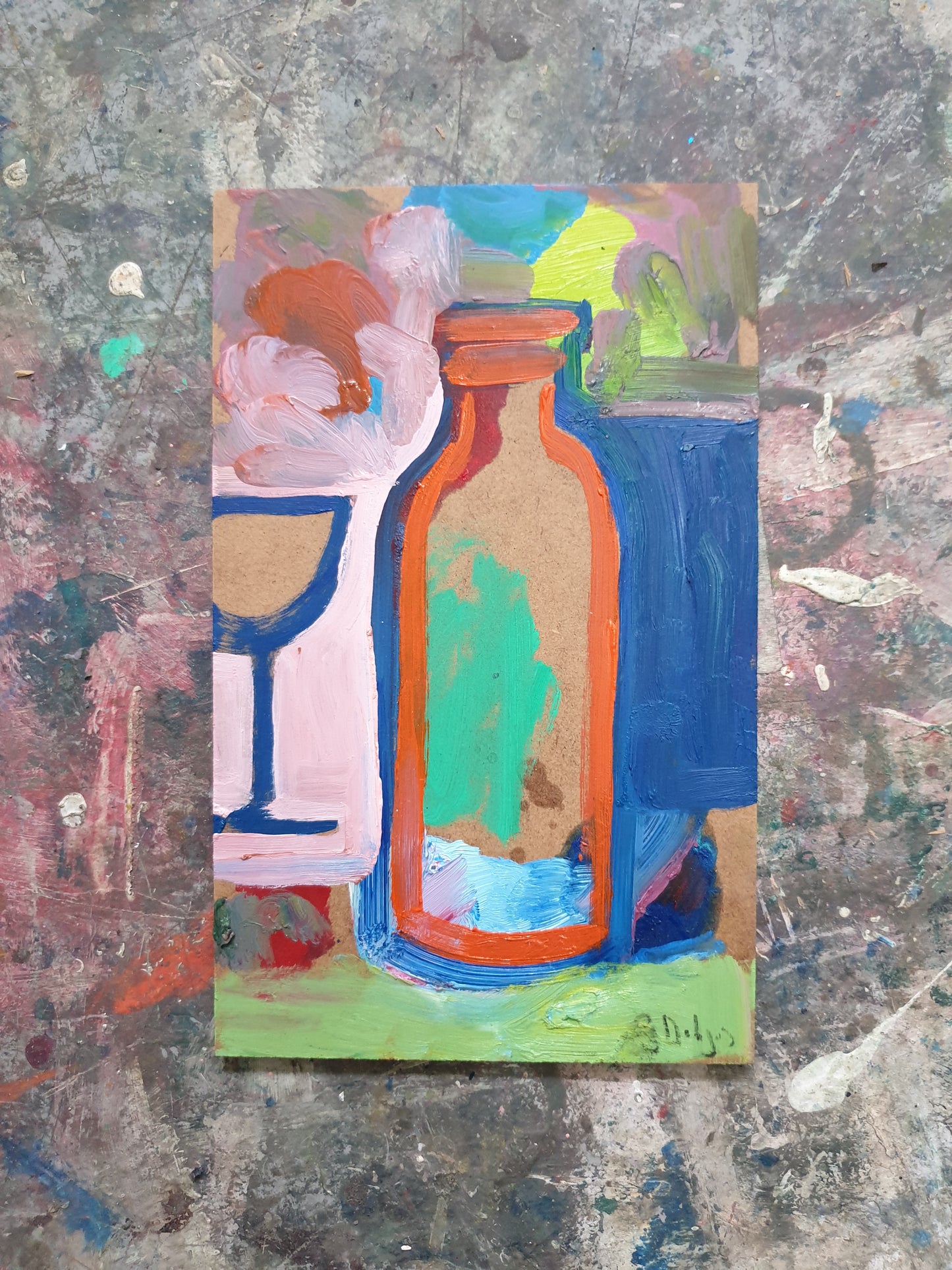 Bottle in front of a glass