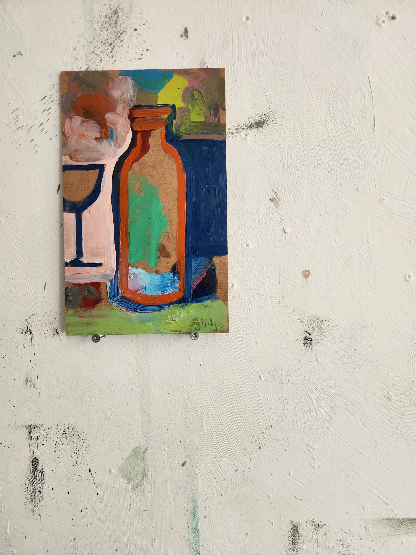 Bottle in front of a glass